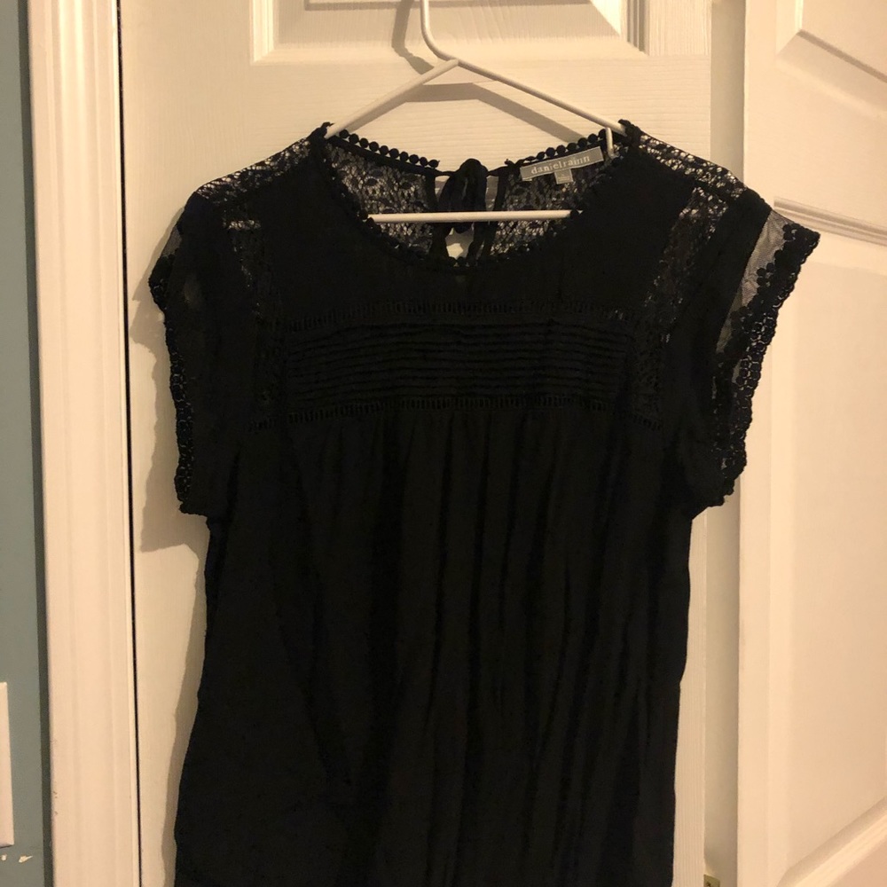 Black top with lace feature size L.